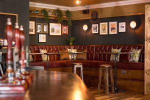 Cosy seating at The Nightingale Pub with corner back bench seating